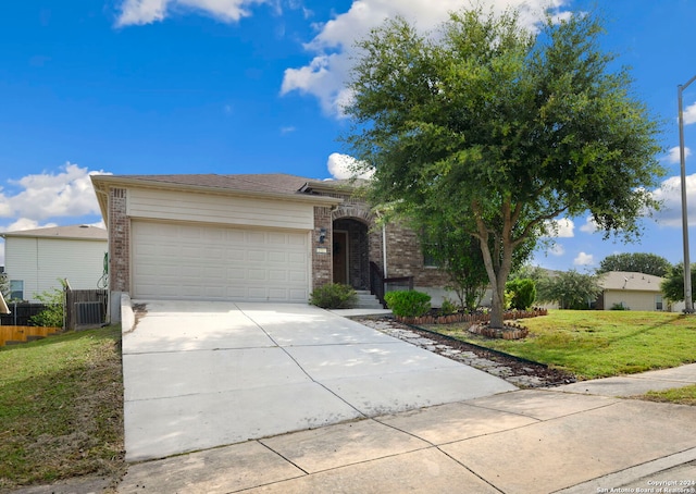 ranch-style house with a garage and a front lawn