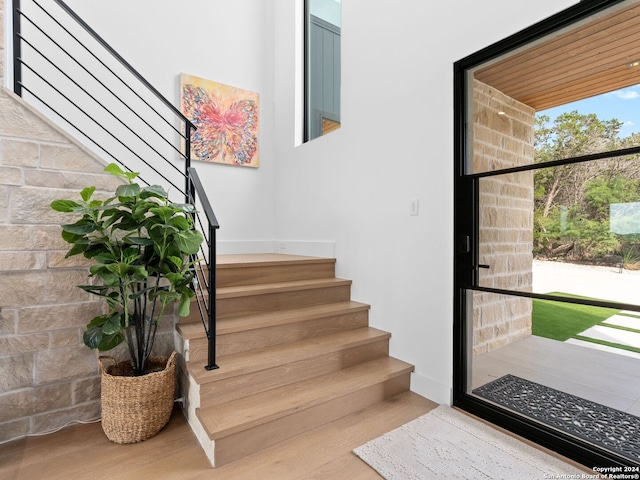 entryway with stairs and wood finished floors