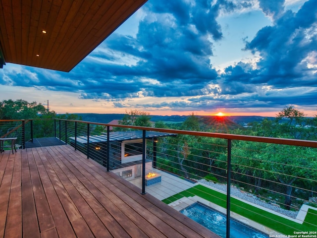 balcony at dusk with a fire pit