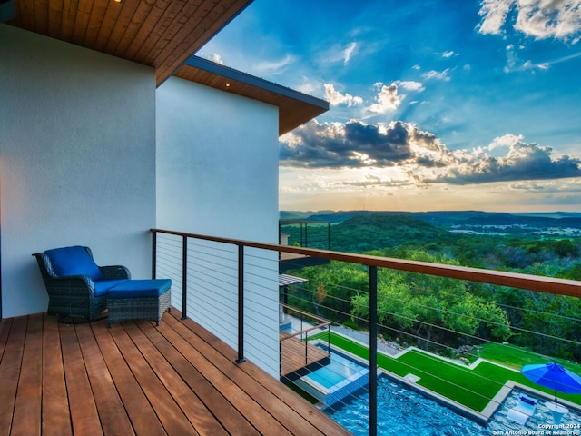 view of balcony at dusk