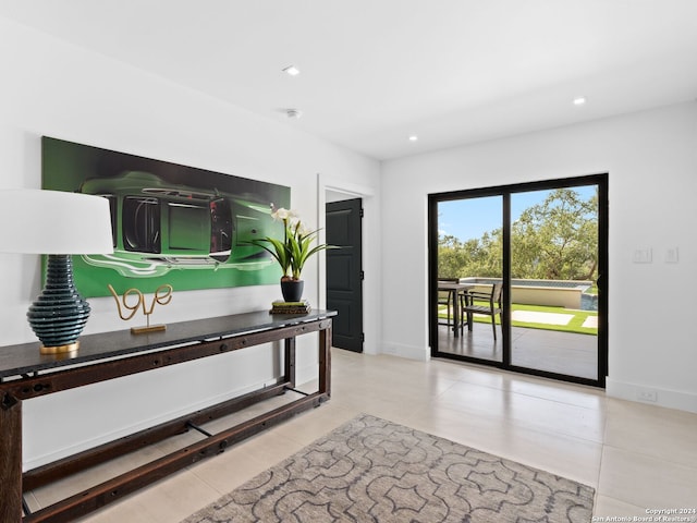 interior space featuring light tile patterned flooring, baseboards, and recessed lighting