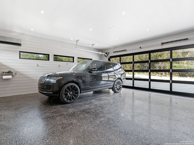 garage with a wall mounted air conditioner