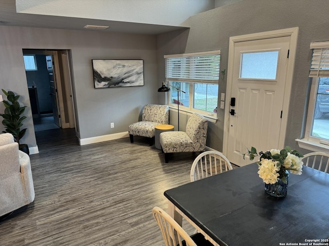 dining area featuring dark hardwood / wood-style floors