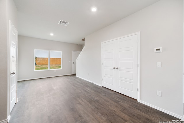 unfurnished living room featuring hardwood / wood-style floors