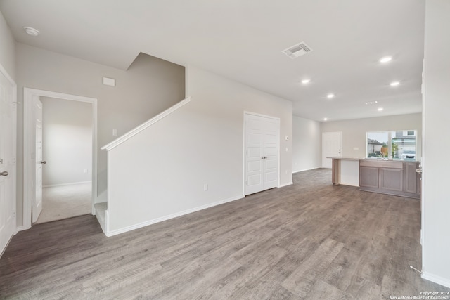 unfurnished living room with hardwood / wood-style floors