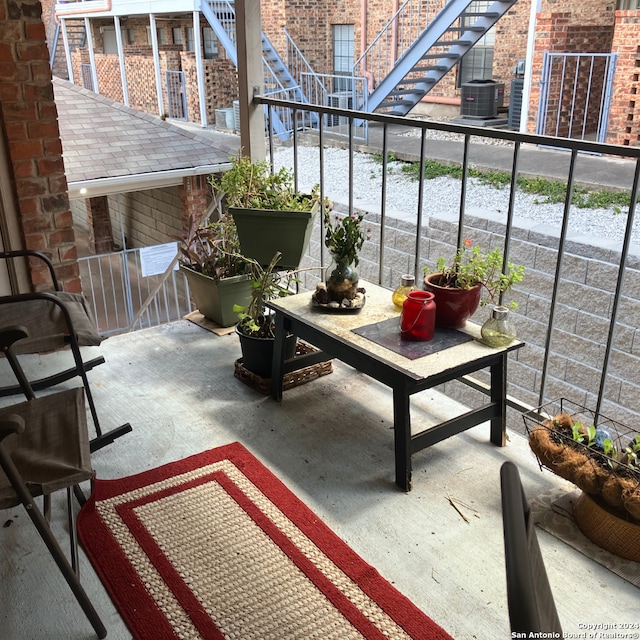 balcony featuring a patio and central AC unit