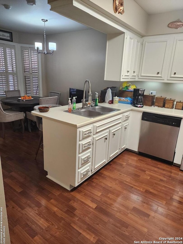 kitchen with sink, white cabinetry, stainless steel dishwasher, kitchen peninsula, and pendant lighting