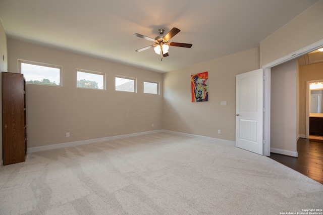 spare room featuring hardwood / wood-style flooring and ceiling fan