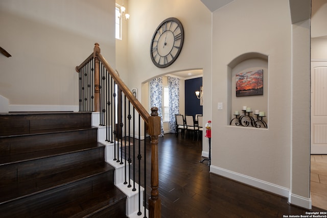 foyer featuring dark hardwood / wood-style flooring and a high ceiling