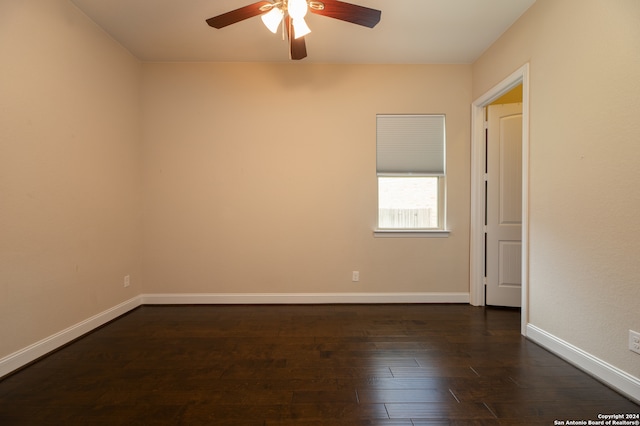 spare room with wood-type flooring and ceiling fan