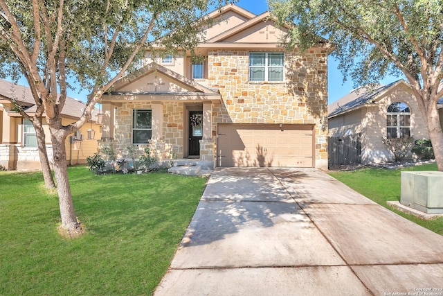 view of front of home featuring a garage, central AC unit, and a front yard