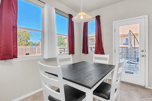 dining space with light tile patterned floors