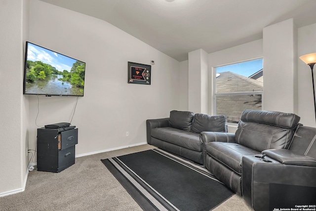 living room featuring vaulted ceiling and carpet