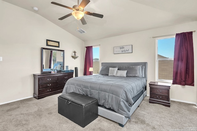 bedroom featuring light carpet, multiple windows, lofted ceiling, and ceiling fan