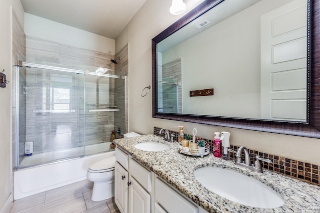 3218 Lilly Flower, San Antonio, TX 78253 - full bathroom with toilet, enclosed tub / shower combo, and double vanity