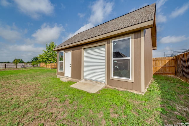 rear view of house with a lawn