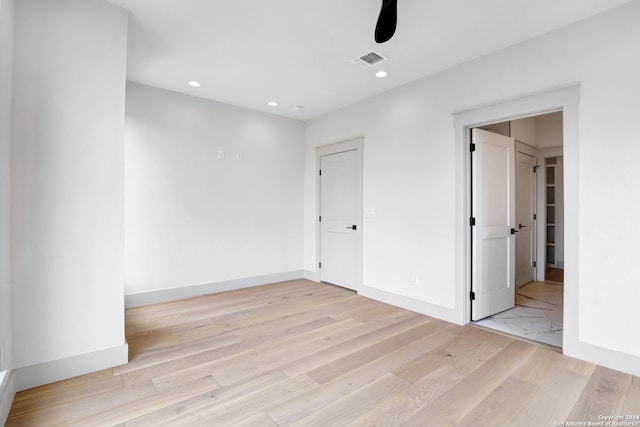 empty room with light hardwood / wood-style floors