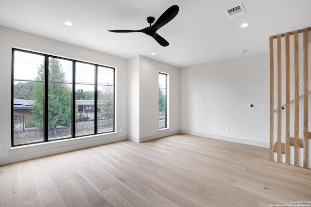 218 Pinckney St, San Antonio, TX 78209 - spare room featuring visible vents, baseboards, light wood finished floors, and recessed lighting
