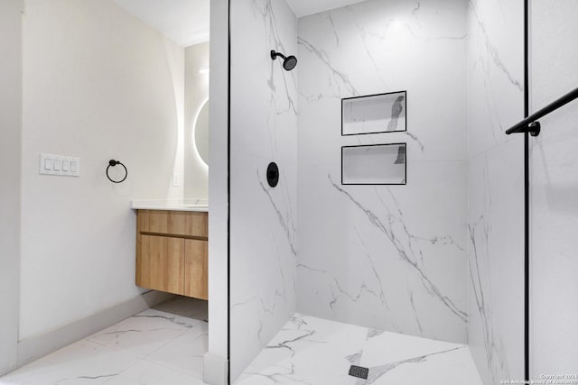218 Pinckney St, San Antonio, TX 78209 - full bath with a marble finish shower, marble finish floor, and vanity