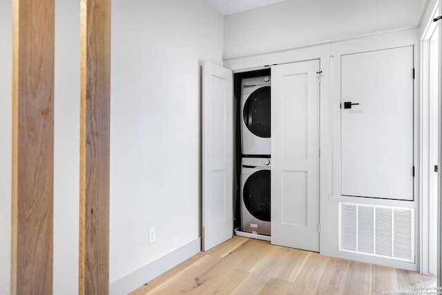 218 Pinckney St, San Antonio, TX 78209 - laundry room featuring light wood-type flooring, visible vents, laundry area, and stacked washer and clothes dryer