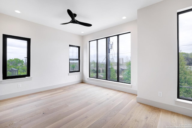218 Pinckney St, San Antonio, TX 78209 - empty room featuring a healthy amount of sunlight, wood finished floors, and recessed lighting