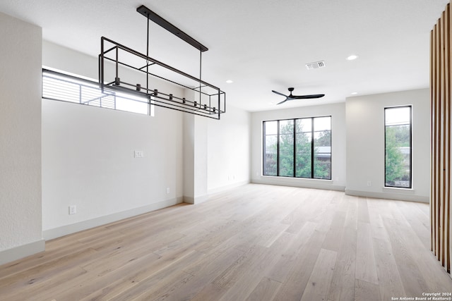 spare room with ceiling fan and light hardwood / wood-style flooring