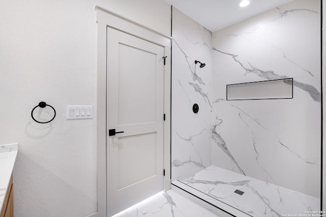 218 Pinckney St, San Antonio, TX 78209 - bathroom featuring recessed lighting, vanity, marble finish floor, and a marble finish shower