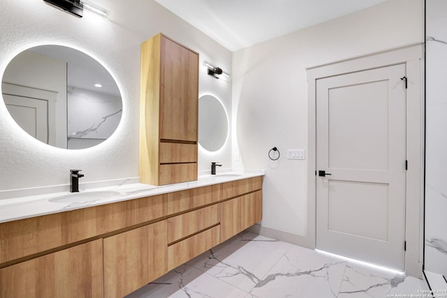 218 Pinckney St, San Antonio, TX 78209 - bathroom with baseboards, double vanity, marble finish floor, and a sink