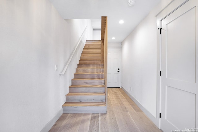 218 Pinckney St, San Antonio, TX 78209 - stairs with recessed lighting, baseboards, and wood finished floors
