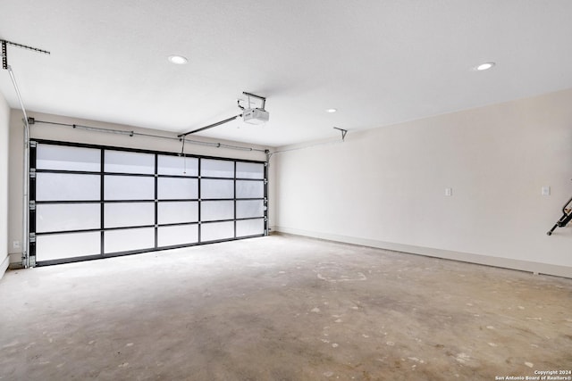 218 Pinckney St, San Antonio, TX 78209 - garage with a garage door opener, baseboards, and recessed lighting