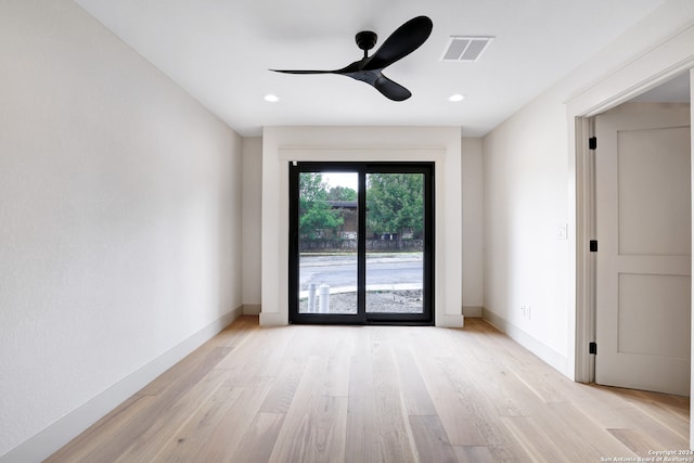 unfurnished room featuring ceiling fan and light wood-type flooring