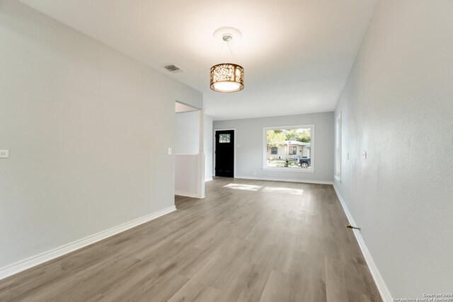 empty room with hardwood / wood-style floors