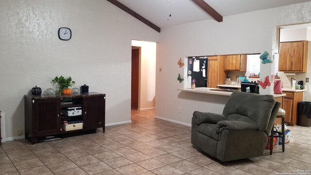 living room featuring beamed ceiling, light tile patterned floors, and high vaulted ceiling