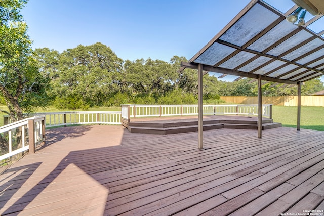 wooden deck featuring a pergola