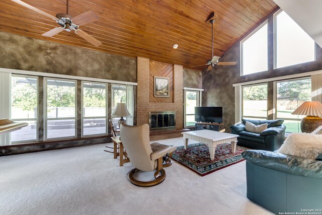 living room featuring high vaulted ceiling, carpet flooring, wood ceiling, and ceiling fan