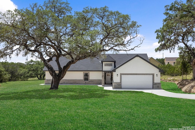 view of front facade with a garage and a front lawn