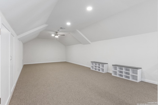 bonus room featuring carpet floors and vaulted ceiling