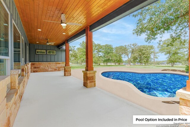 view of pool featuring ceiling fan and a patio area