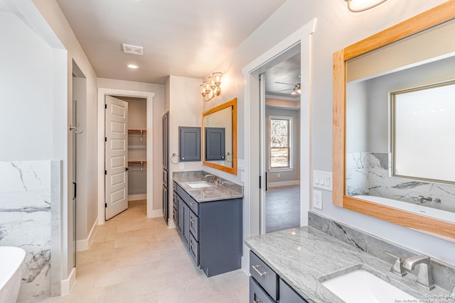 bathroom with vanity and ceiling fan