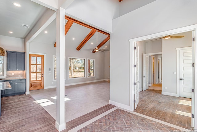 entryway featuring ceiling fan, beam ceiling, high vaulted ceiling, and light hardwood / wood-style flooring