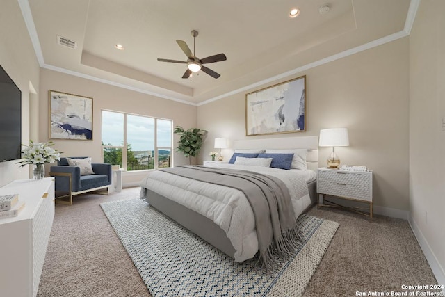 bedroom featuring crown molding, ceiling fan, a raised ceiling, and carpet floors