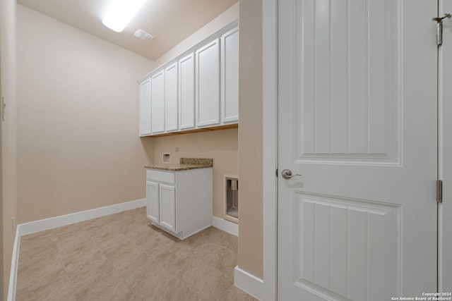 washroom featuring cabinets and washer hookup