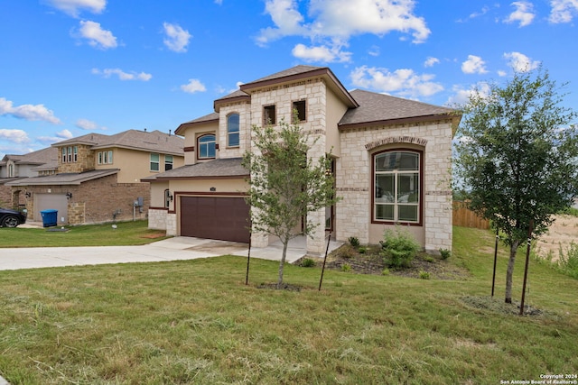 view of front of home with a garage and a front yard