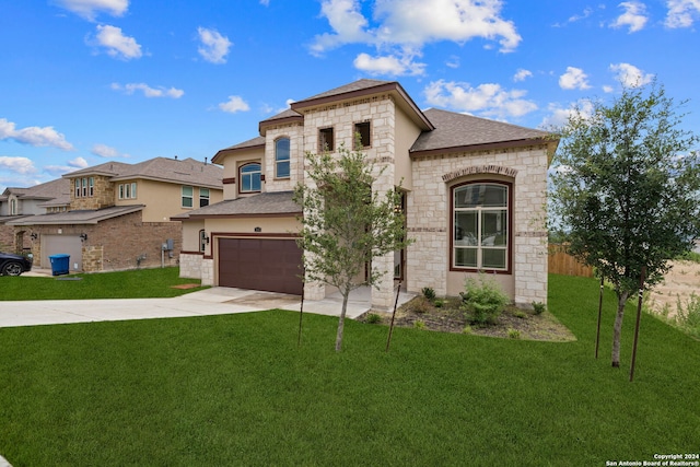 view of front of property with a garage and a front yard