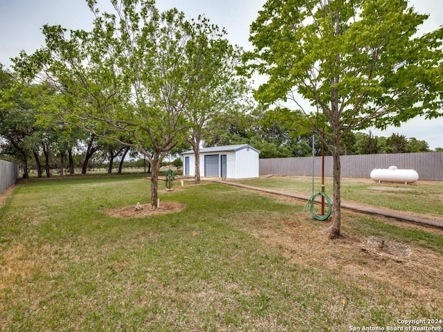 view of yard with an outbuilding and a garage