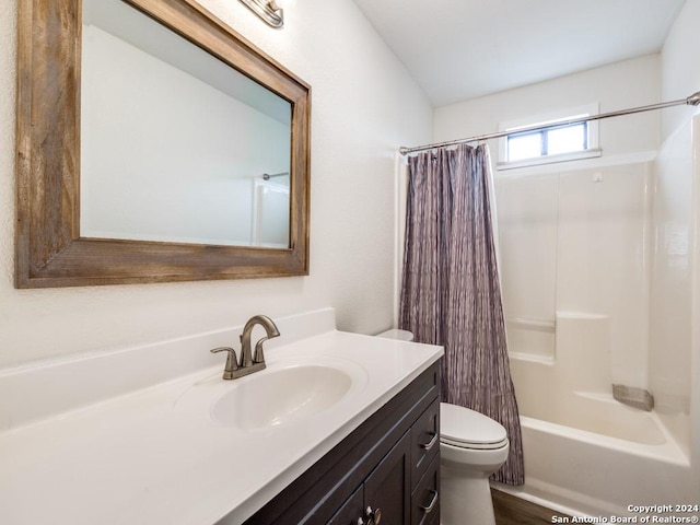 full bathroom featuring vanity, toilet, and shower / bath combo with shower curtain