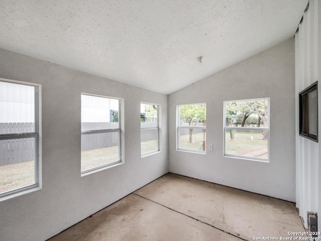 unfurnished sunroom with vaulted ceiling