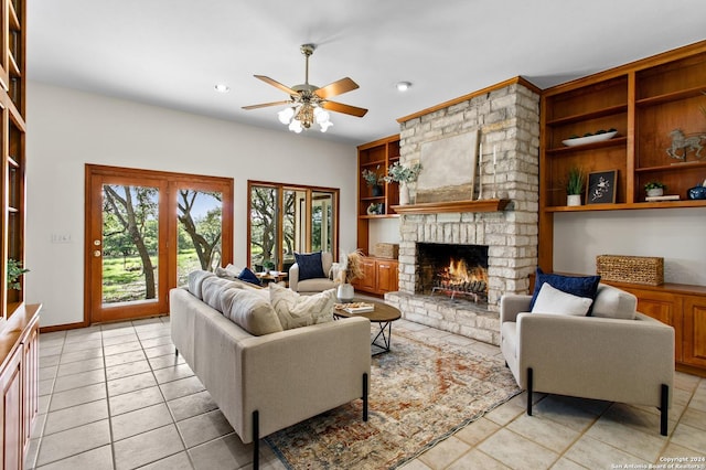 living area featuring built in features, light tile patterned floors, a brick fireplace, a ceiling fan, and recessed lighting