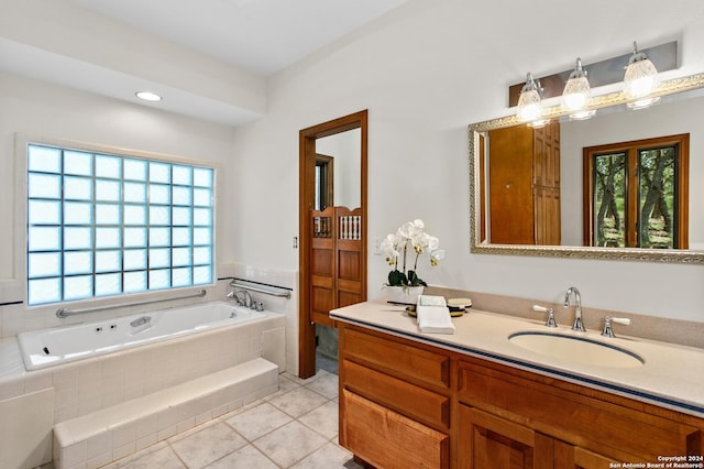 full bathroom with tile patterned floors, vanity, and a garden tub