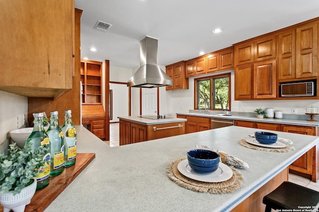 kitchen with visible vents, light tile patterned floors, light countertops, appliances with stainless steel finishes, and island exhaust hood